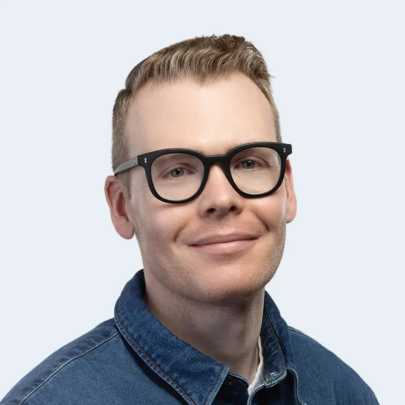 A headshot of Travis Riedlhuber, EVP of Product & Technology at Knower Tech.